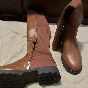 Light brown heeled boots. Never been worn.